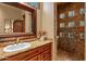 Bathroom with granite vanity and walk-in shower at 9533 E Rising Sun Dr, Scottsdale, AZ 85262