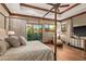 Bright bedroom with a king-size bed, large windows, and mountain views at 9533 E Rising Sun Dr, Scottsdale, AZ 85262