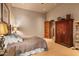 Bright bedroom with king-size bed and built-in wardrobe at 9533 E Rising Sun Dr, Scottsdale, AZ 85262