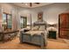 Charming guest bedroom with a queen-size bed and mountain views at 9533 E Rising Sun Dr, Scottsdale, AZ 85262
