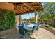 Covered patio with a large table and chairs, perfect for outdoor dining at 9533 E Rising Sun Dr, Scottsdale, AZ 85262