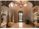 Elegant entryway with high ceilings and a chandelier at 9533 E Rising Sun Dr, Scottsdale, AZ 85262