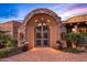 Ornate arched gate entrance to a luxurious property at 9533 E Rising Sun Dr, Scottsdale, AZ 85262