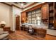 Home office with built-in desk and shelving at 9533 E Rising Sun Dr, Scottsdale, AZ 85262