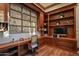 Home office with built-in desk and abundant shelving at 9533 E Rising Sun Dr, Scottsdale, AZ 85262