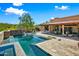 Resort-style pool and spa with expansive patio and seating at 9533 E Rising Sun Dr, Scottsdale, AZ 85262