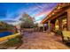 Stunning pool area with a covered patio, comfortable seating, and beautiful sunset views at 9533 E Rising Sun Dr, Scottsdale, AZ 85262
