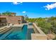 Luxury pool and spa with stonework and mountain views at 9533 E Rising Sun Dr, Scottsdale, AZ 85262