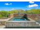 Relaxing spa with stonework and mountain views at 9533 E Rising Sun Dr, Scottsdale, AZ 85262