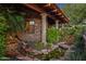 Serene water feature with lush landscaping near house entrance at 9533 E Rising Sun Dr, Scottsdale, AZ 85262
