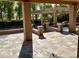 Spacious flagstone patio adjacent to the pool area at 11809 S Warpaint Dr, Phoenix, AZ 85044