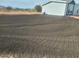 Large backyard with tilled soil, ready for landscaping at 310 N Brower Rd, Maricopa, AZ 85139
