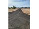 Long driveway leading to a new manufactured home at 310 N Brower Rd, Maricopa, AZ 85139