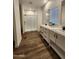 Bathroom boasts double sinks and a large walk-in shower at 310 N Brower Rd, Maricopa, AZ 85139