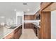 Spacious kitchen with dark wood cabinets and granite countertops at 3130 S 234Th Ln, Buckeye, AZ 85326