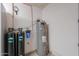 Utility room with water softener, filter and hot water heater at 6253 S Avenida La Manana St, Gold Canyon, AZ 85118