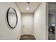 Clean entryway with a large mirror and wood-look flooring at 823 S Silvercreek Ct, Casa Grande, AZ 85122