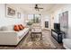 Relaxing living room with a neutral-colored couch and tiled floors at 14950 W Mountain View Blvd # 1305, Surprise, AZ 85374