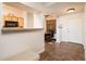 Inviting entryway with tile flooring and views into living and dining areas at 14950 W Mountain View Blvd # 1305, Surprise, AZ 85374