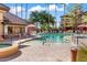 Resort-style pool with spa and surrounding landscaping at 14950 W Mountain View Blvd # 1305, Surprise, AZ 85374