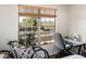 Bedroom with view, desk, and two bicycles at 14950 W Mountain View Blvd # 1305, Surprise, AZ 85374