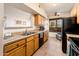 Bright kitchen features ample cabinetry, tile flooring, and modern appliances at 14950 W Mountain View Blvd # 1305, Surprise, AZ 85374