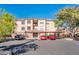 Apartment building exterior with parking and landscaping at 14950 W Mountain View Blvd # 1305, Surprise, AZ 85374