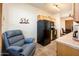 Cozy kitchen nook with recliner and view to balcony at 14950 W Mountain View Blvd # 1305, Surprise, AZ 85374