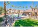 Community pool with lounge chairs and BBQ area at 14950 W Mountain View Blvd # 1305, Surprise, AZ 85374