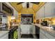 Kitchen with yellow ceiling, white cabinets, and appliances at 4609 E Valley View Dr, Phoenix, AZ 85044