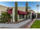 Spanish style home with red awnings, walkway, and landscaping at 4609 E Valley View Dr, Phoenix, AZ 85044