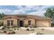 Single-story home with stone and stucco exterior at 20209 W San Miguel Ave, Litchfield Park, AZ 85340