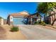 Two-car garage, front yard landscaping, and a single-story home at 38617 N Jonathan St, San Tan Valley, AZ 85140