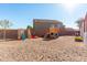 playset and other play features in the backyard at 38617 N Jonathan St, San Tan Valley, AZ 85140