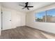 Spacious bedroom with wood-look floors and ceiling fan at 4630 N 68Th St # 215, Scottsdale, AZ 85251