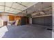 Spacious garage with overhead storage and ample space for vehicles at 19865 E Augustus Ave, Queen Creek, AZ 85142