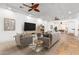 Bright living room with hardwood floors and stylish furniture at 19865 E Augustus Ave, Queen Creek, AZ 85142