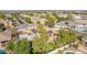 An aerial view showcasing the property, pool, and surrounding neighborhood at 19865 E Augustus Ave, Queen Creek, AZ 85142