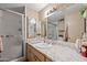Bathroom with shower, vanity, and marble countertop at 5201 W Camelback Rd # 204, Phoenix, AZ 85031