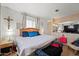 Spacious main bedroom with a king-size bed and TV at 5201 W Camelback Rd # 204, Phoenix, AZ 85031