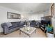Living room with two sofas, a coffee table, and a TV at 5201 W Camelback Rd # 204, Phoenix, AZ 85031