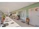 Covered patio with seating area and potted plants at 5201 W Camelback Rd # 204, Phoenix, AZ 85031