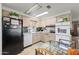 Kitchen with light wood cabinets, dishwasher, and microwave at 5201 W Camelback Rd # 204, Phoenix, AZ 85031