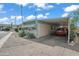 Mobile home with carport and landscaping at 5201 W Camelback Rd # 204, Phoenix, AZ 85031