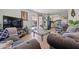 Living room with gray sofas, a coffee table, and kitchen view at 5201 W Camelback Rd # 204, Phoenix, AZ 85031