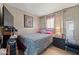 Second bedroom with double bed and TV at 5201 W Camelback Rd # 204, Phoenix, AZ 85031