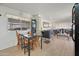 Cozy dining area with a glass-top table and chairs, adjacent to the kitchen at 5201 W Camelback Rd # 204, Phoenix, AZ 85031