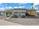 Mobile home with covered porch and landscaping at 5201 W Camelback Rd # 204, Phoenix, AZ 85031
