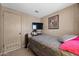 Bedroom with a double bed and a wall-mounted TV at 5201 W Camelback Rd # 204, Phoenix, AZ 85031