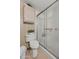 Clean bathroom with toilet, shower, and cabinet at 5201 W Camelback Rd # 204, Phoenix, AZ 85031